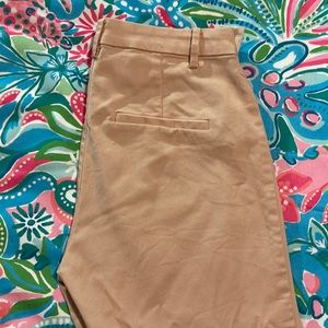 Pale pink cropped dress pants.